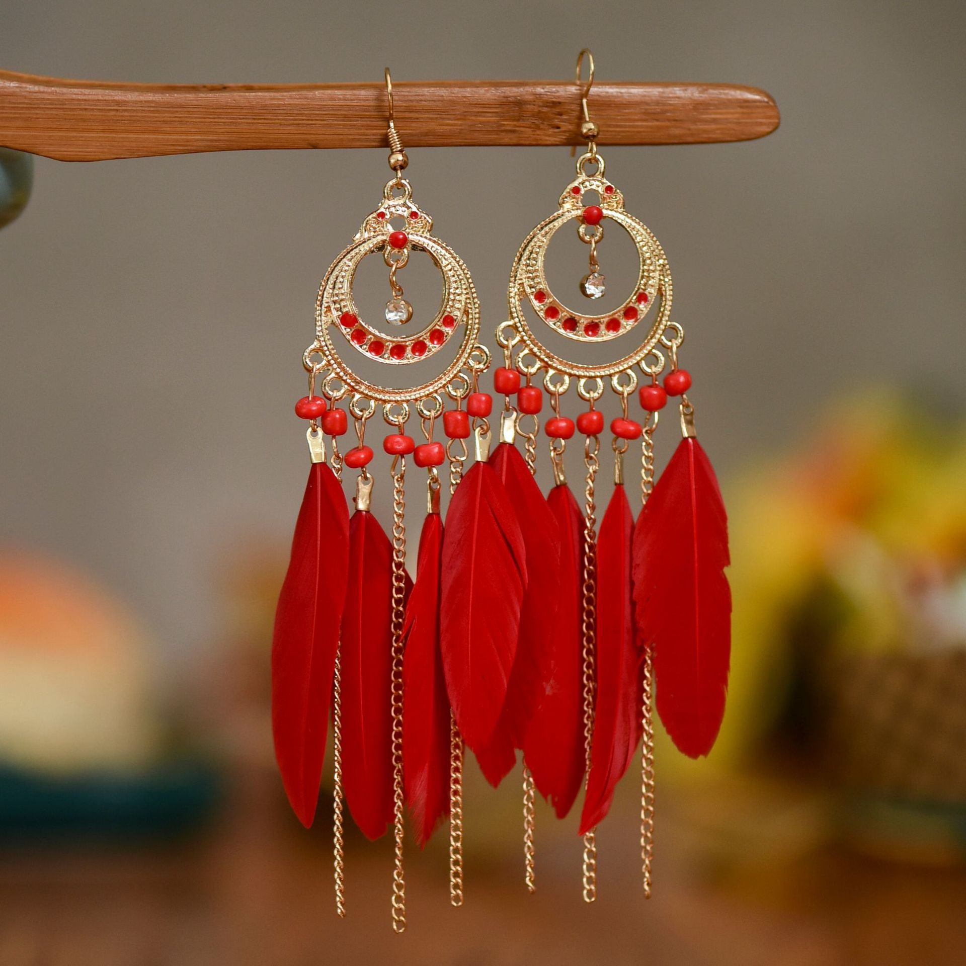 Long Bohemian fringe feather earrings