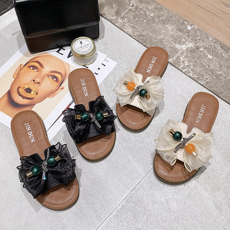 Beach slippers with bow on beef tendon sole