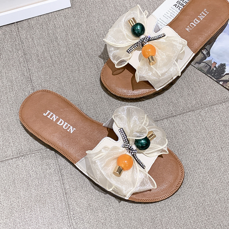 Beach slippers with bow on beef tendon sole