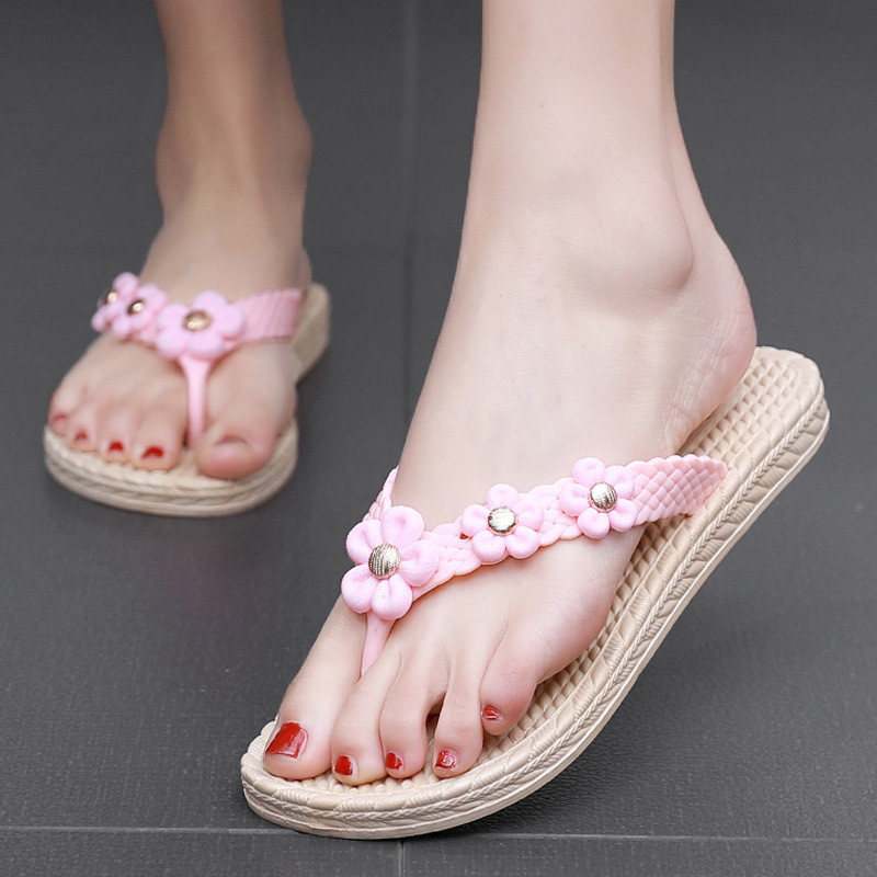 Plastic flip-flops with flowers