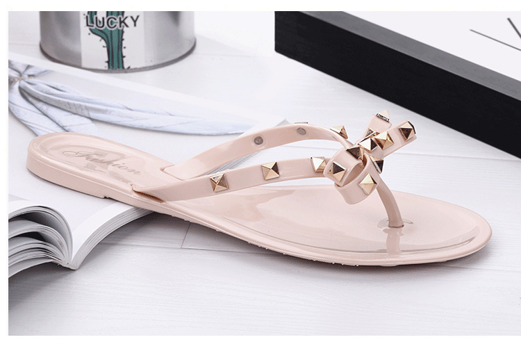Studded bow flip-flops